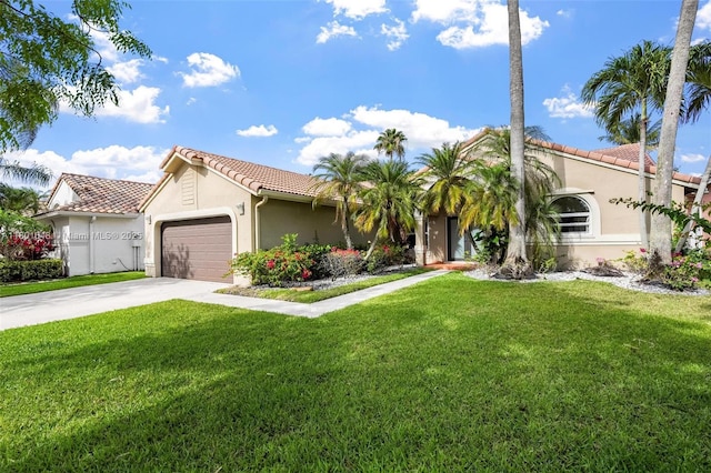 782 Lake Blvd, Weston, FL 33326 - mediterranean / spanish-style home with stucco siding, a tile roof, an attached garage, a front yard, and driveway