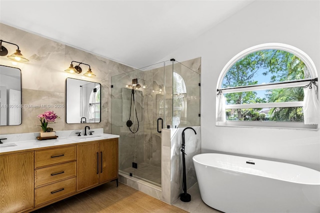 782 Lake Blvd, Weston, FL 33326 - full bath featuring a stall shower, a freestanding tub, double vanity, and lofted ceiling