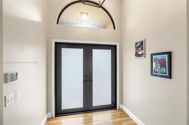 782 Lake Blvd, Weston, FL 33326 - doorway with wood finished floors, baseboards, and french doors