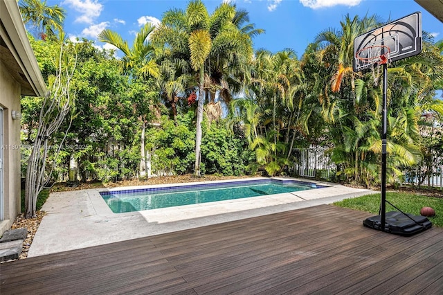 782 Lake Blvd, Weston, FL 33326 - view of swimming pool with a fenced backyard, a deck, and view of wooded area