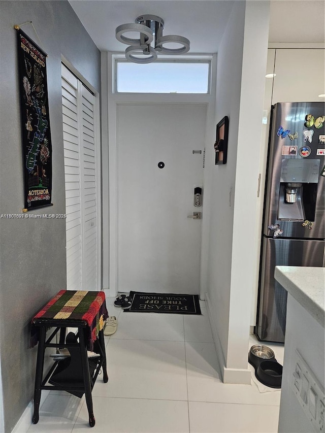 619 NE 14th Ave Unit 106, Hallandale Beach, FL 33009 - corridor with tile patterned flooring and baseboards