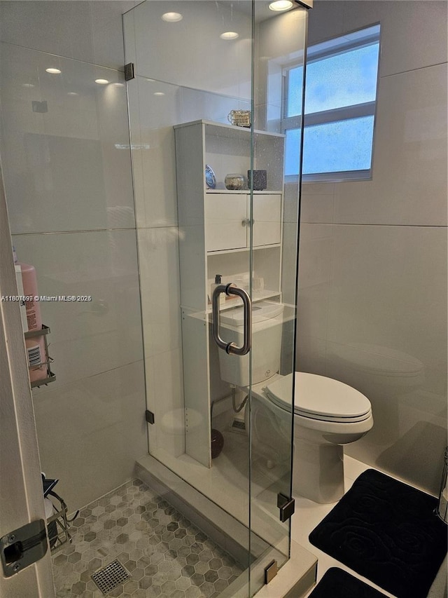 619 NE 14th Ave Unit 106, Hallandale Beach, FL 33009 - full bath with toilet, a shower stall, and tile patterned floors