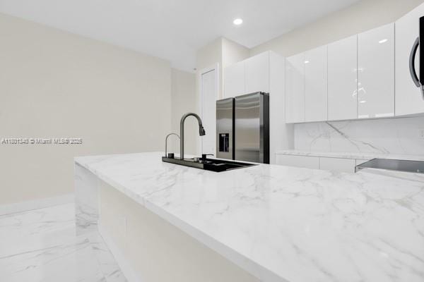 428/430 Petite Ave, Lehigh Acres, FL 33974 - kitchen with stainless steel fridge, a sink, modern cabinets, light stone countertops, and recessed lighting