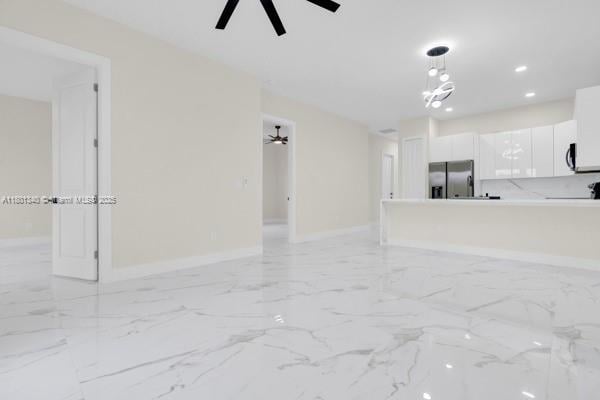428/430 Petite Ave, Lehigh Acres, FL 33974 - unfurnished living room featuring ceiling fan, baseboards, recessed lighting, and light marble finish flooring