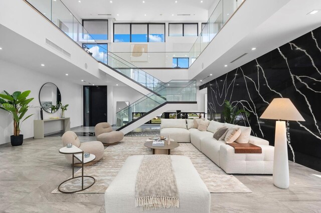 521 Holiday Dr, Hallandale Beach, FL 33009 - common area featuring a towering ceiling, stairs, and recessed lighting