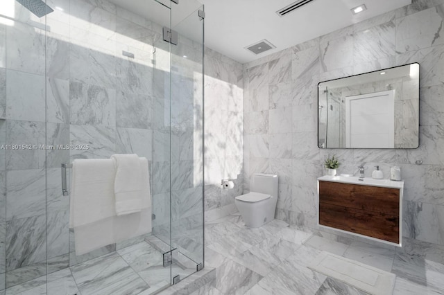 521 Holiday Dr, Hallandale Beach, FL 33009 - bathroom with tile walls, vanity, toilet, marble look tiles, and a stall shower