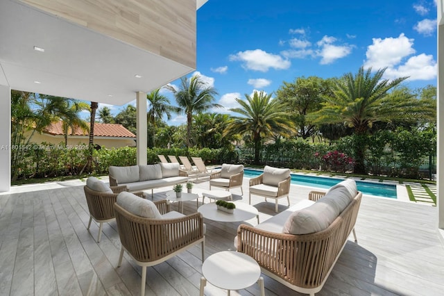 521 Holiday Dr, Hallandale Beach, FL 33009 - deck with an outdoor living space and an outdoor pool