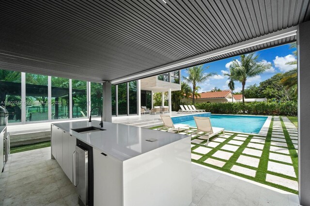 521 Holiday Dr, Hallandale Beach, FL 33009 - view of swimming pool featuring a patio, area for grilling, and a bar