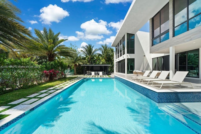 521 Holiday Dr, Hallandale Beach, FL 33009 - swimming pool featuring a patio
