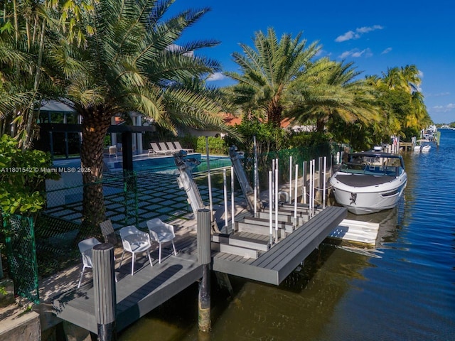 521 Holiday Dr, Hallandale Beach, FL 33009 - dock area featuring a water view and boat lift