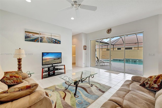 living room featuring ceiling fan, recessed lighting, a sunroom, light tile patterned floors, and baseboards