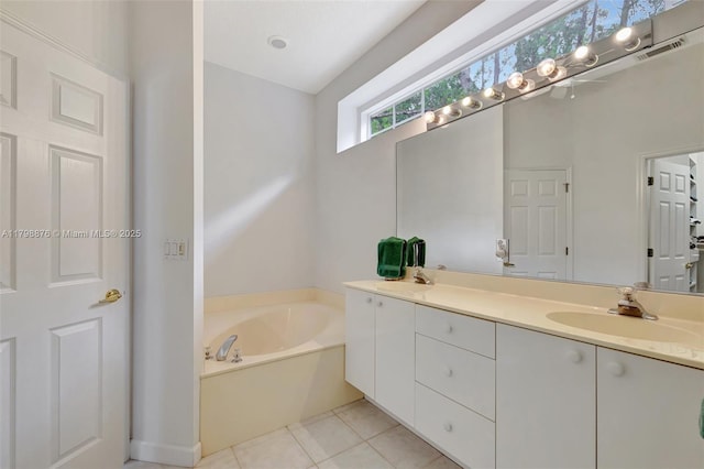 full bath with a bath, vanity, and tile patterned floors