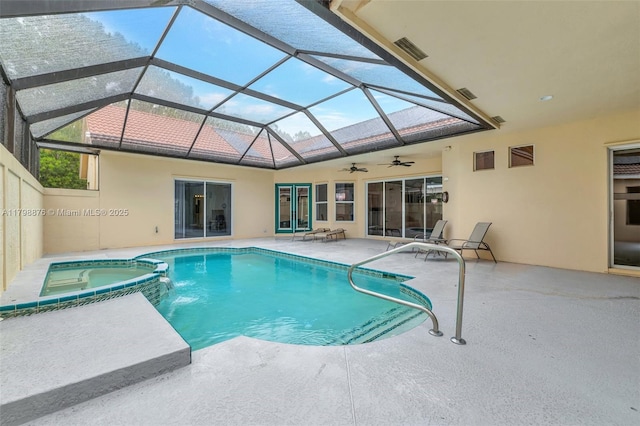 view of swimming pool featuring a patio, a ceiling fan, a pool with connected hot tub, and glass enclosure