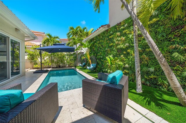 1496 Breakwater Ter, Hollywood, FL 33019 - view of swimming pool featuring a patio area
