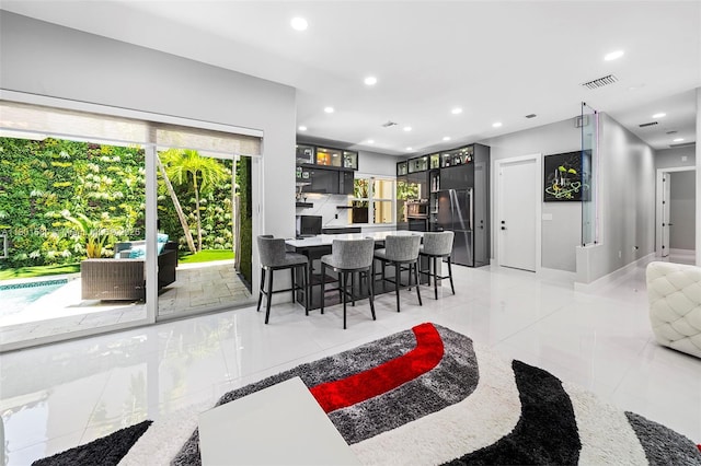 1496 Breakwater Ter, Hollywood, FL 33019 - dining space with plenty of natural light, recessed lighting, and light tile patterned floors