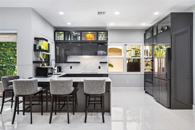 1496 Breakwater Ter, Hollywood, FL 33019 - bar featuring stainless steel appliances, recessed lighting, tasteful backsplash, and baseboards