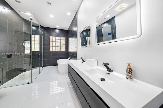 1496 Breakwater Ter, Hollywood, FL 33019 - bathroom with a stall shower, a freestanding bath, double vanity, tile patterned floors, and recessed lighting