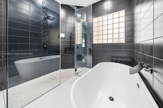 1496 Breakwater Ter, Hollywood, FL 33019 - full bath featuring a freestanding bath, a stall shower, and tile walls