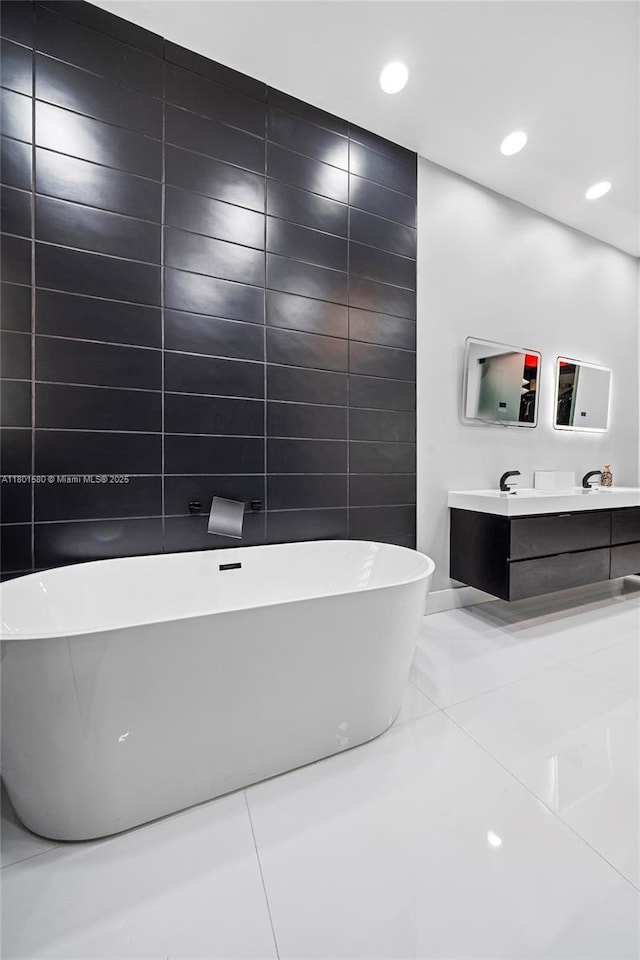 1496 Breakwater Ter, Hollywood, FL 33019 - bathroom with a freestanding tub, double vanity, and recessed lighting