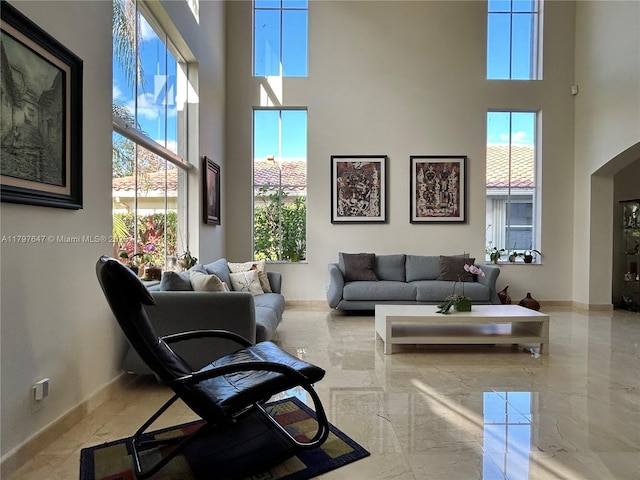 3968 Nighthawk Dr, Weston, FL 33331 - living room with a high ceiling, plenty of natural light, arched walkways, and baseboards