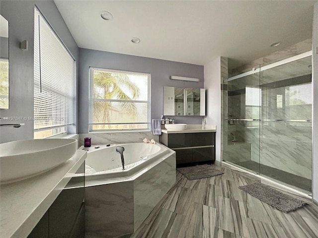 3968 Nighthawk Dr, Weston, FL 33331 - full bath with a tub with jets, a stall shower, and vanity