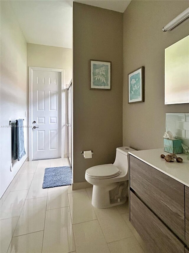 3968 Nighthawk Dr, Weston, FL 33331 - full bath with toilet, a shower stall, tile patterned floors, vanity, and baseboards