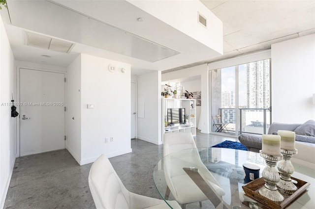 151 SE 1st St Unit 1610, Miami, FL 33131 - dining room with baseboards and finished concrete floors