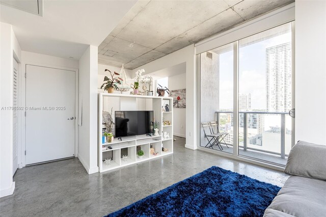 151 SE 1st St Unit 1610, Miami, FL 33131 - living area featuring baseboards and concrete flooring