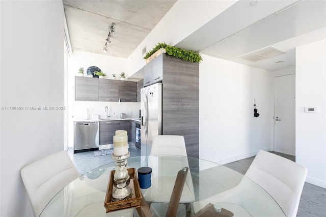 151 SE 1st St Unit 1610, Miami, FL 33131 - dining area featuring track lighting and baseboards