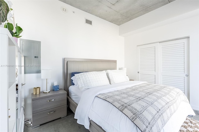 151 SE 1st St Unit 1610, Miami, FL 33131 - bedroom featuring a closet and dark colored carpet
