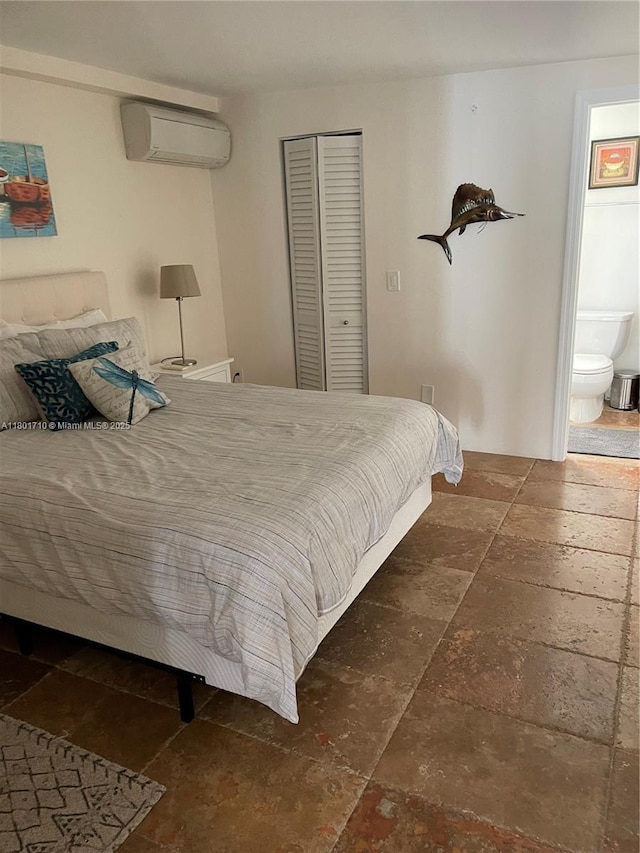 314 SE 4th St, Dania Beach, FL 33004 - bedroom featuring stone tile floors, a wall mounted air conditioner, and a closet