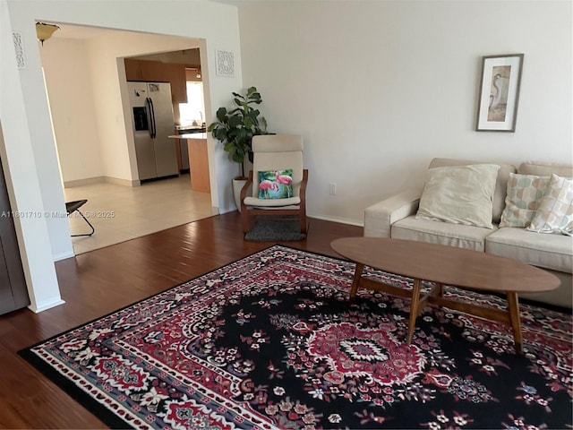 314 SE 4th St, Dania Beach, FL 33004 - living room featuring light wood-type flooring and baseboards