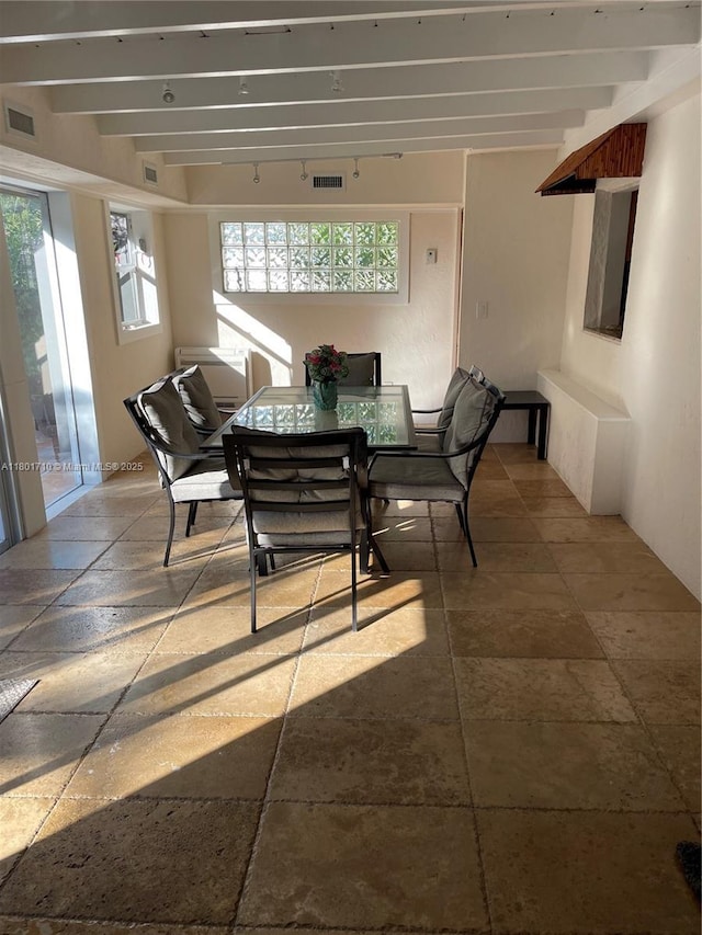 314 SE 4th St, Dania Beach, FL 33004 - dining room with beam ceiling and stone tile flooring