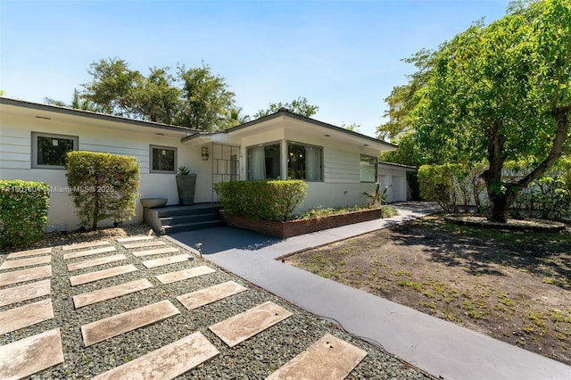 650 NE 60th St, Miami, FL 33137 - view of front of property featuring a garage