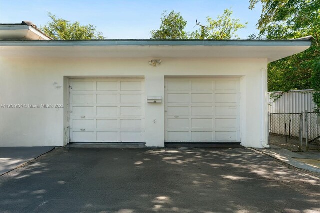 650 NE 60th St, Miami, FL 33137 - garage with asphalt driveway