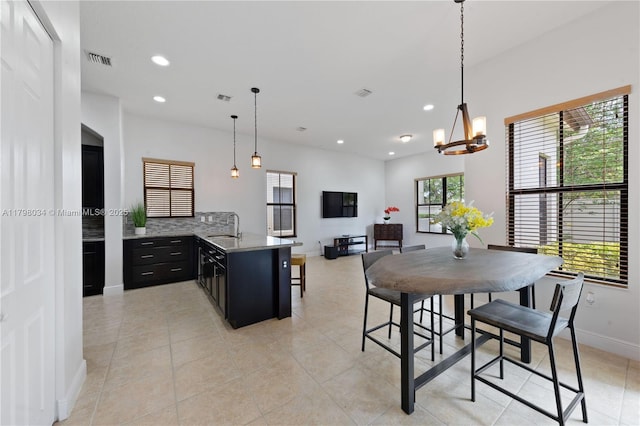 2691 NW 83rd Ter, Cooper City, FL 33024 - dining space featuring recessed lighting, a chandelier, baseboards, and light tile patterned floors