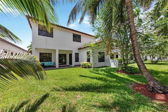 2691 NW 83rd Ter, Cooper City, FL 33024 - rear view of property featuring stucco siding and a yard