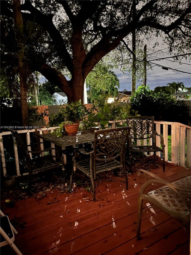 327 SE 2nd Ave, Dania Beach, FL 33004 - wooden terrace with outdoor dining space