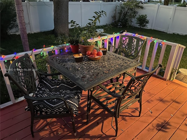 327 SE 2nd Ave, Dania Beach, FL 33004 - wooden terrace featuring a fenced backyard and outdoor dining area