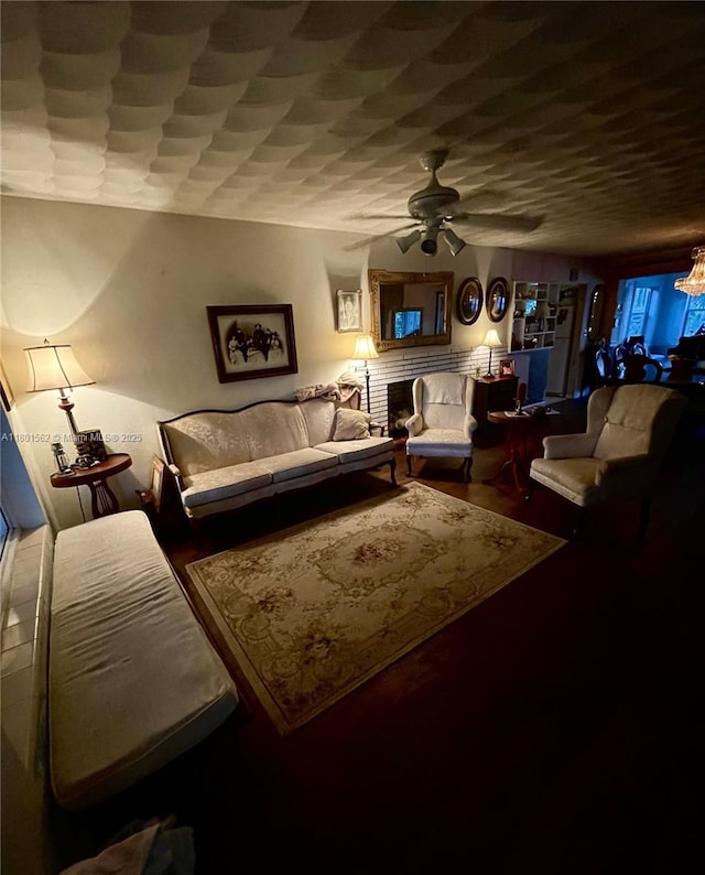 327 SE 2nd Ave, Dania Beach, FL 33004 - living room featuring a ceiling fan, wood finished floors, and a brick fireplace