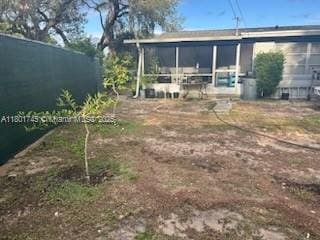 view of yard featuring a sunroom