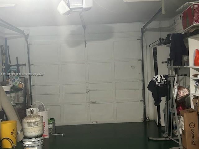 garage featuring a garage door opener