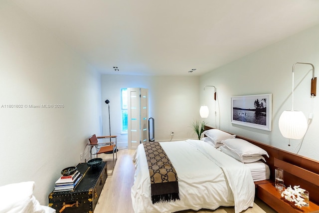 bedroom with light wood-type flooring