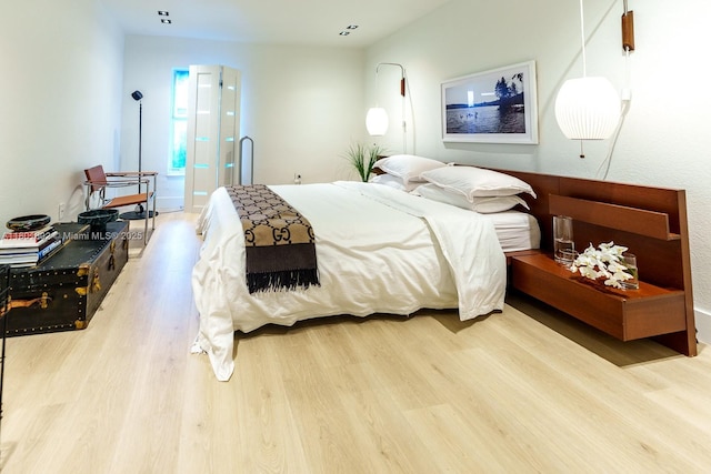 bedroom with wood finished floors