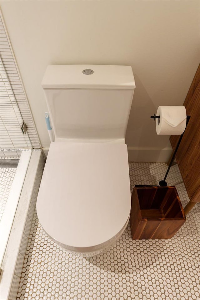 bathroom featuring tile patterned flooring and toilet