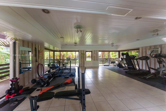 exercise room featuring light tile patterned floors
