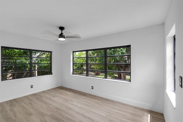 8935 NW 10th Ave, Miami, FL 33150 - spare room featuring a ceiling fan, light wood-type flooring, and baseboards