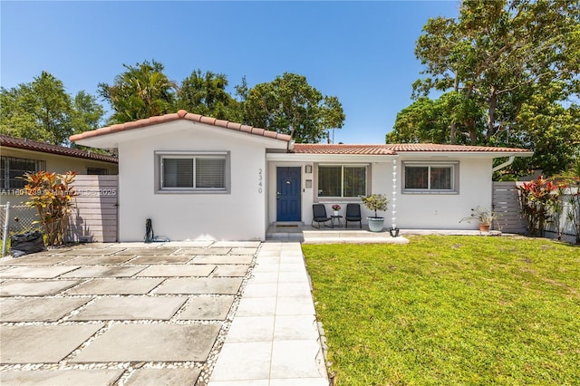 2340 SW 17th Ave, Miami, FL 33145 - view of front of property with a tile roof and stucco siding