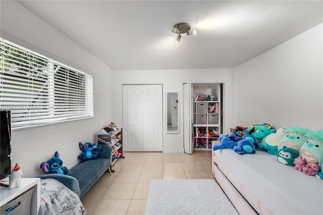 2340 SW 17th Ave, Miami, FL 33145 - bedroom featuring light tile patterned floors, a closet, and electric panel