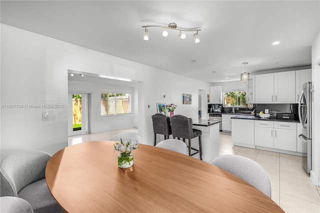2340 SW 17th Ave, Miami, FL 33145 - dining room with light tile patterned floors and recessed lighting